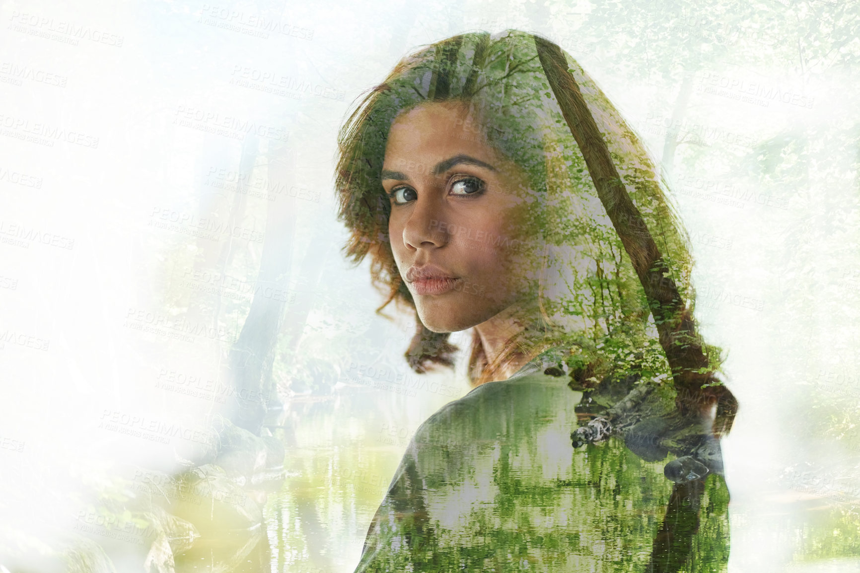 Buy stock photo Multiple exposure shot of young businesswoman superimposed over a forest landscape