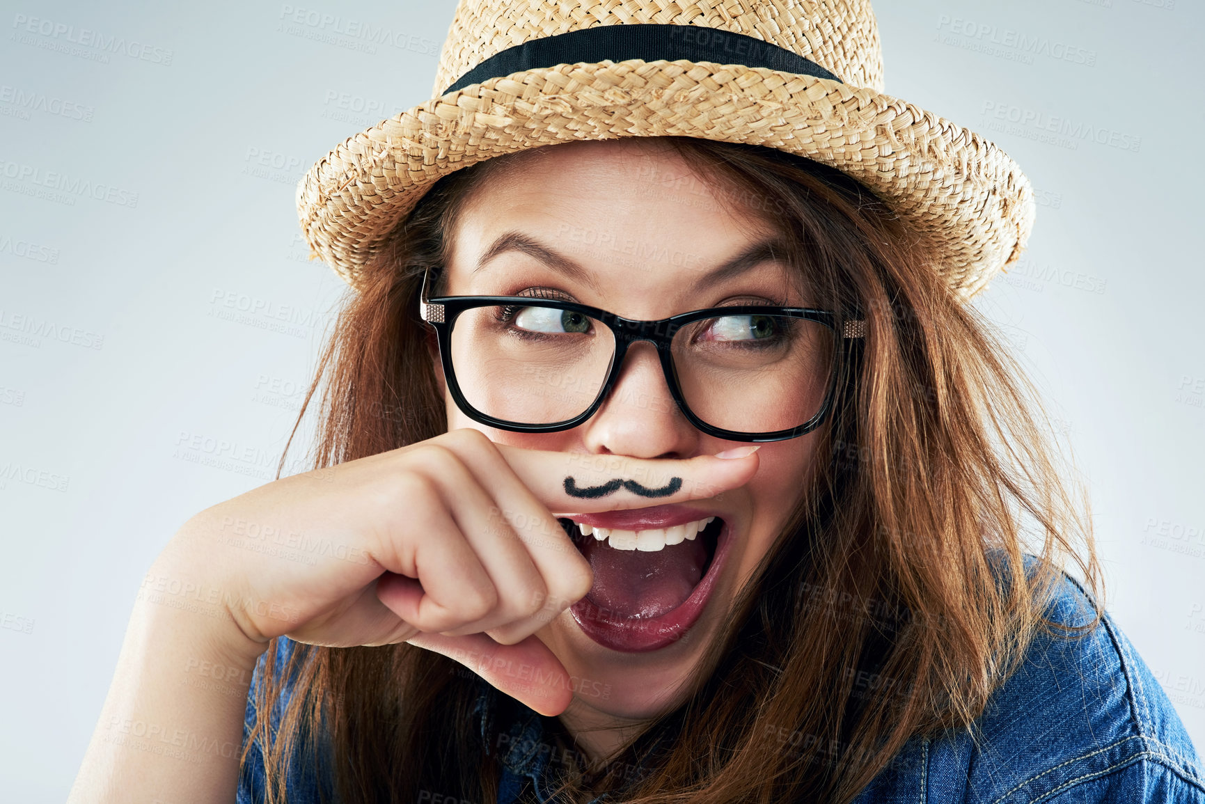 Buy stock photo Funny, woman and hand with mustache in studio for wow, surprise and secret with glasses. Female hipster, photo booth and creative on white background with expression, comic and modern fashion