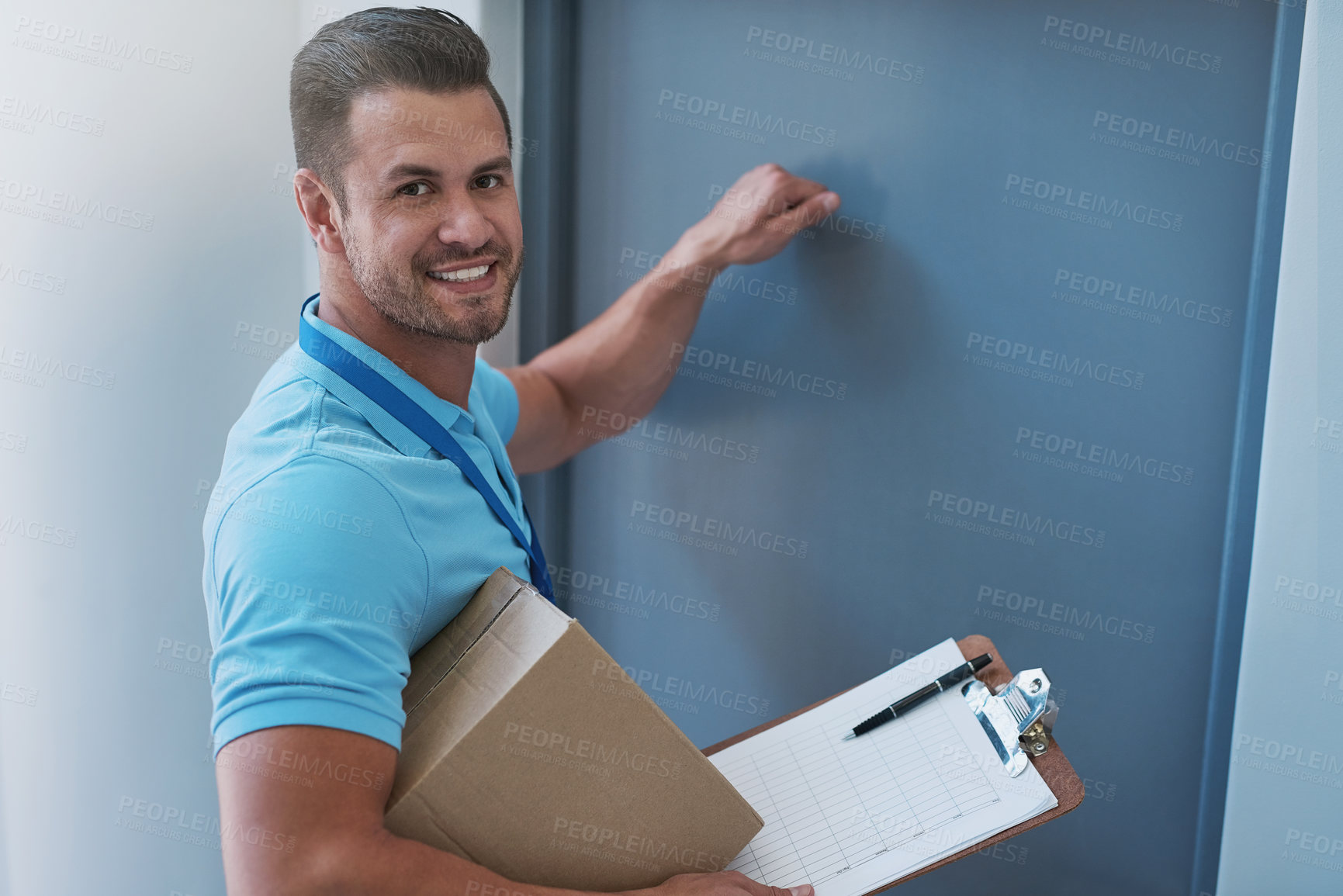 Buy stock photo Portrait of a courier knocking on a door to make a delivery