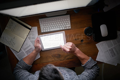 Buy stock photo High angle shot of an unidentifiable computer programmer working alone late at night