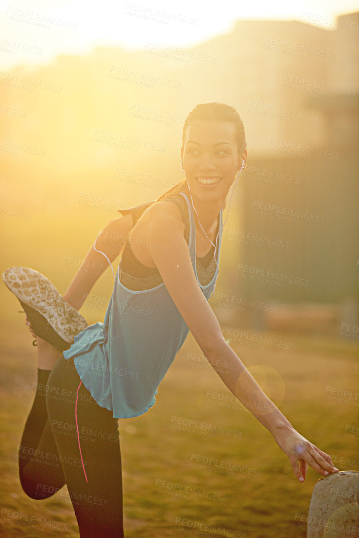 Buy stock photo Woman, stretching and park with smile for exercise with thinking, subscription or buildings in city. Girl, person and athlete at training, workout or earphones for music streaming for warm up at park