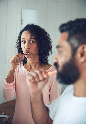 Buy stock photo Couple, brushing teeth and bathroom in morning, dental wellness and worry with thinking in home. Mature man, woman and toothbrush for cleaning mouth together with concern, stress or hygiene in house