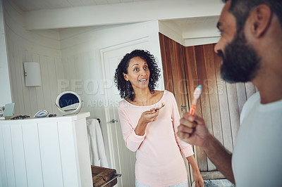 Buy stock photo Shot of a mature couple brushing their teeth at home