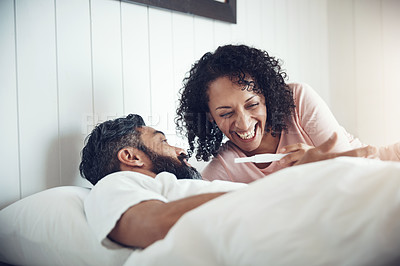 Buy stock photo Couple, surprise and bedroom with pregnancy test, positive and bed with smile, results and excited. Man, woman and baby with stick, love and maternity for future family, parents and pregnant together