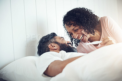Buy stock photo Couple, happy and laughter with pregnancy test, positive and bed with smile, results and excited. Man, woman and baby with stick, love and maternity for future family, surprise and pregnant together