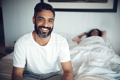 Buy stock photo Portrait of a mature man looking happy while his wife sleeps in the background