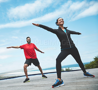 Buy stock photo Fitness, health and couple doing outdoor pilates stretching together for body balance exercise. Happy, smile and young man and woman doing a yoga warm up workout or challenge for health in nature.