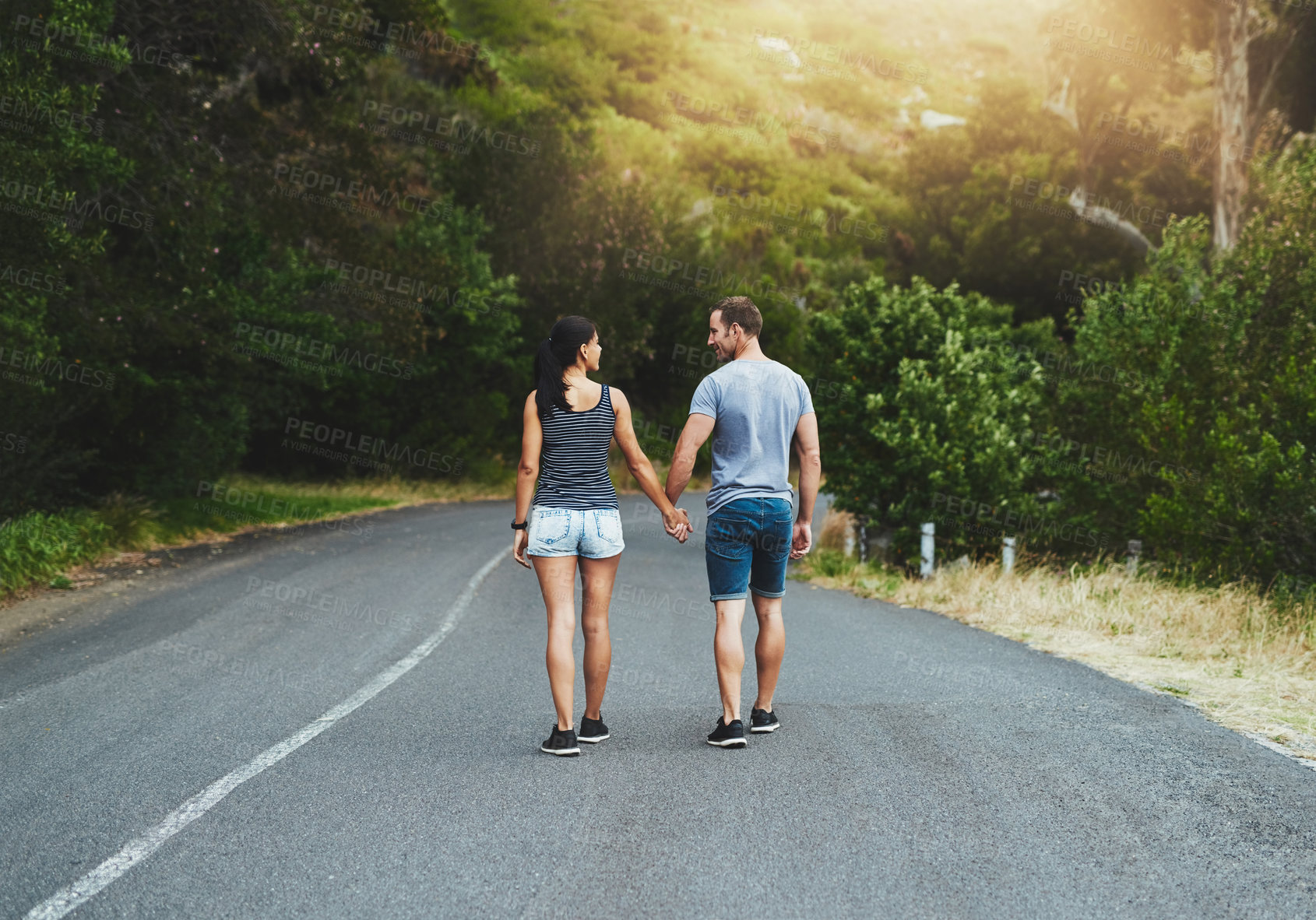 Buy stock photo Road, travel or couple holding hands or walking on date with trust, care for romance, hiking or adventure. Loyalty, love or man with woman on holiday vacation together for bond, support or wellness