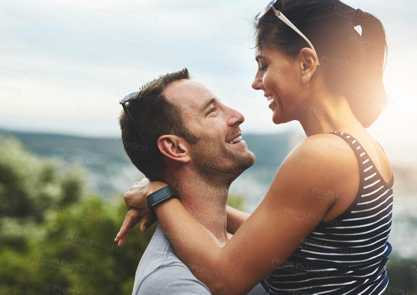 Buy stock photo Excited, love or happy couple hug in park for date or care in nature with support, bond or summer. Eye contact, romantic man or woman on fun holiday vacation together to celebrate, relax or travel