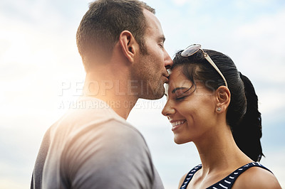 Buy stock photo Forehead, love or couple kiss in park for date, wellness or care on summer romance or adventure. Support, smile or man with happy woman on outdoor holiday vacation together to bond, travel or relax