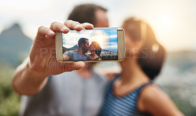 Buy stock photo Phone screen, selfie and couple kiss in nature outdoor on summer vacation together. Smartphone, romance and picture of man and woman in countryside for connection, memory of love and relationship