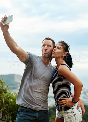 Buy stock photo Air kiss, selfie and couple in nature outdoor for freedom on summer vacation together. Romantic man, woman and picture in countryside for connection, love memory or healthy relationship on adventure