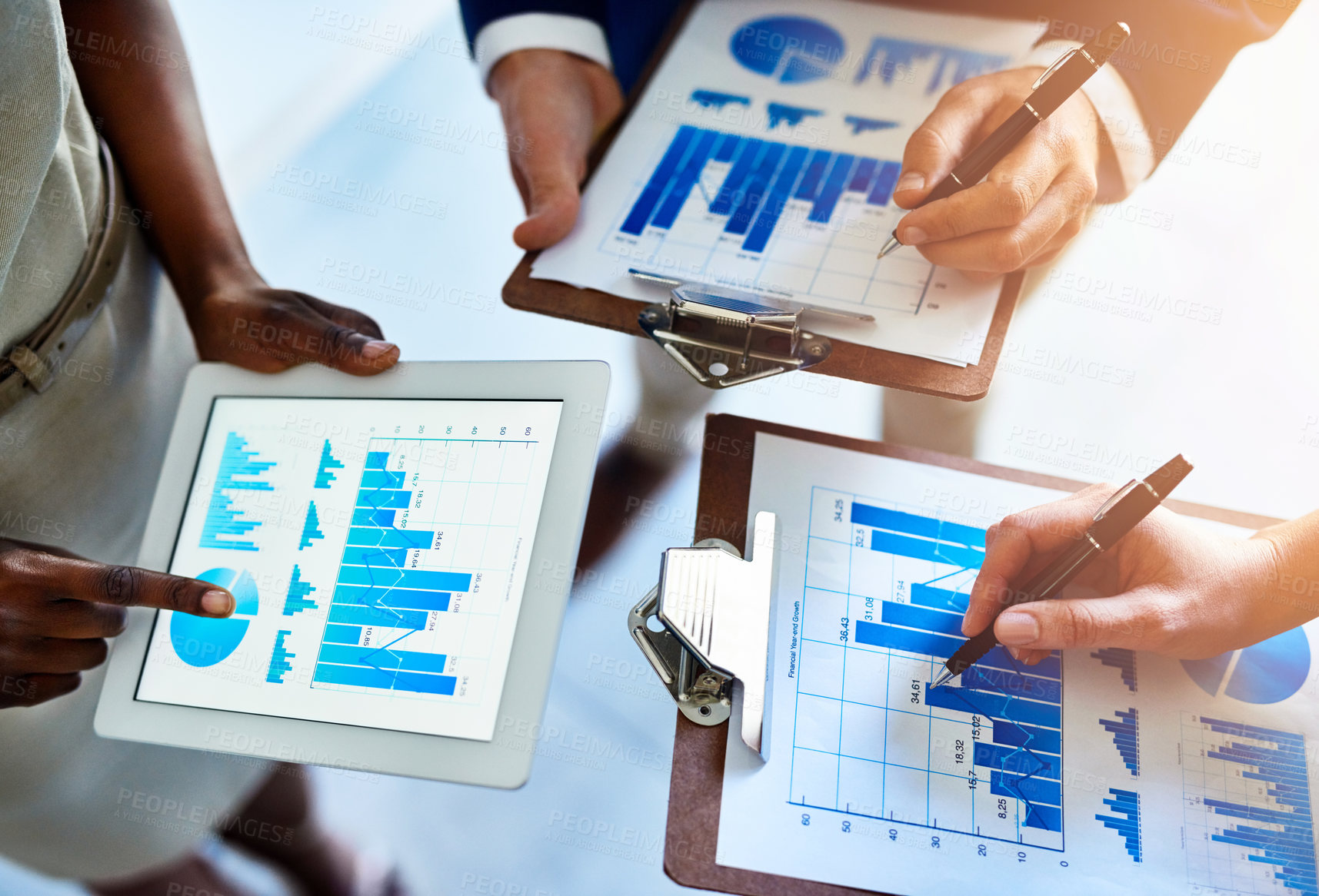 Buy stock photo Tablet, clipboard and hands of business people with charts, graphs and metrics in productivity meeting. Data analysis, teamwork and paperwork for statistics, digital app or sales development planning