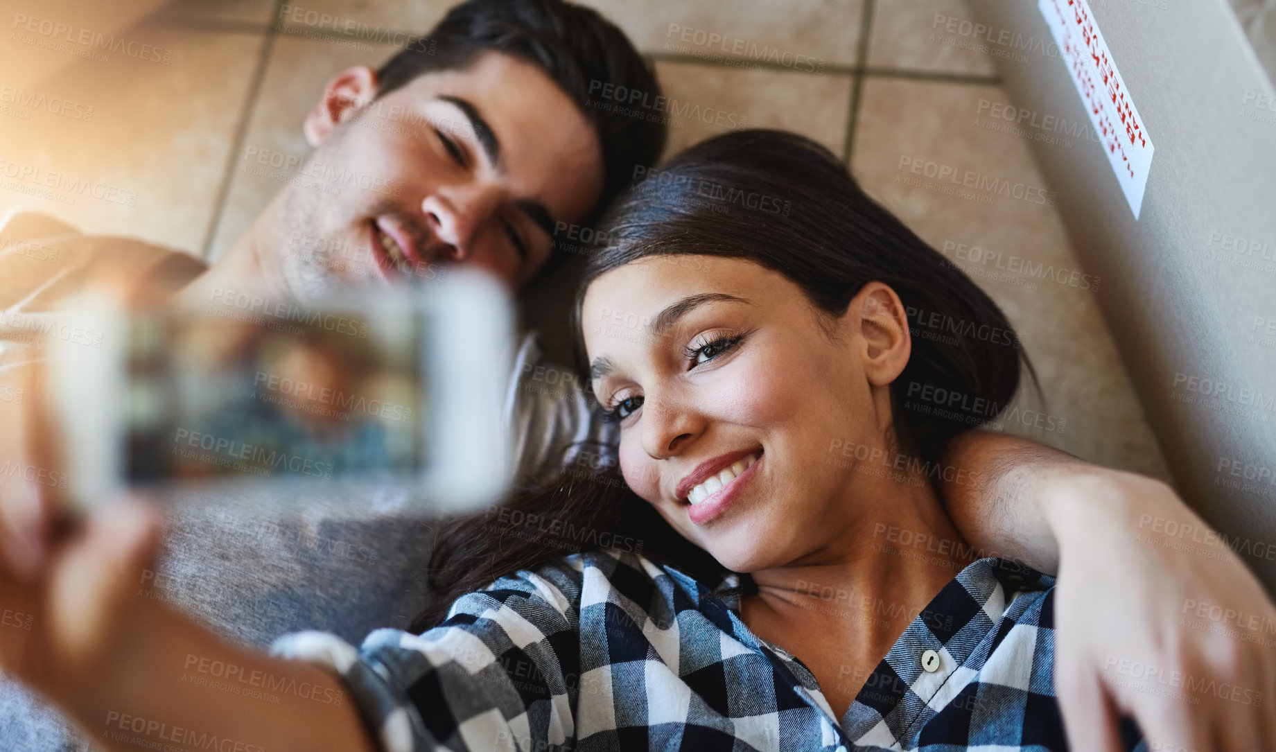 Buy stock photo Couple, selfie and floor or above in home, happy and smile on app in apartment with love for moving post on social media. Internet, update and memory or photography bonding, care and rent achievement