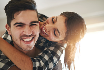 Buy stock photo Portrait of a happy young couple celebrating their move into a new home