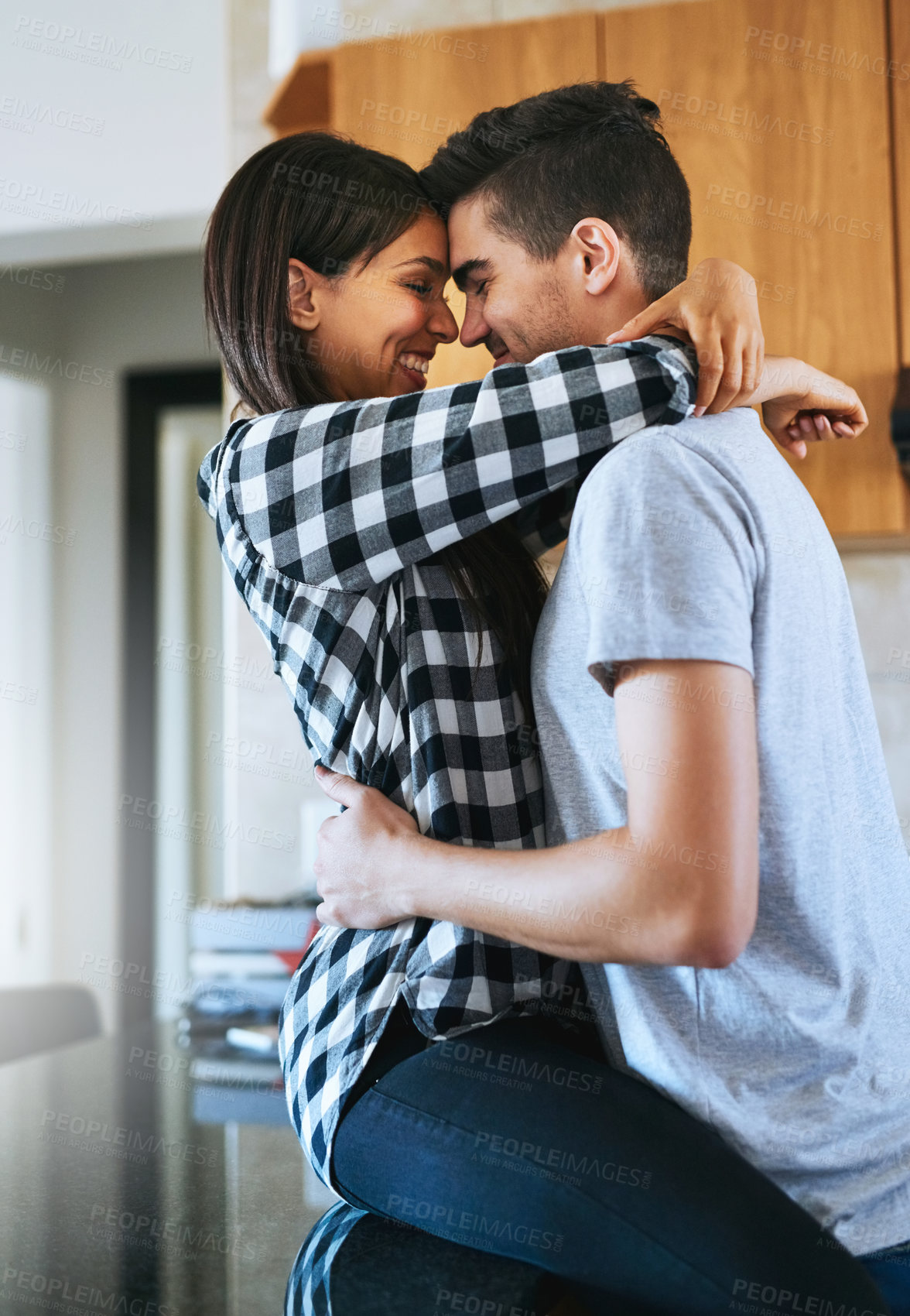 Buy stock photo Couple, new home and hug with love, kitchen and happy from investment and marriage. Moving, together and bonding with embrace and romance of people with care, trust and support in relationship