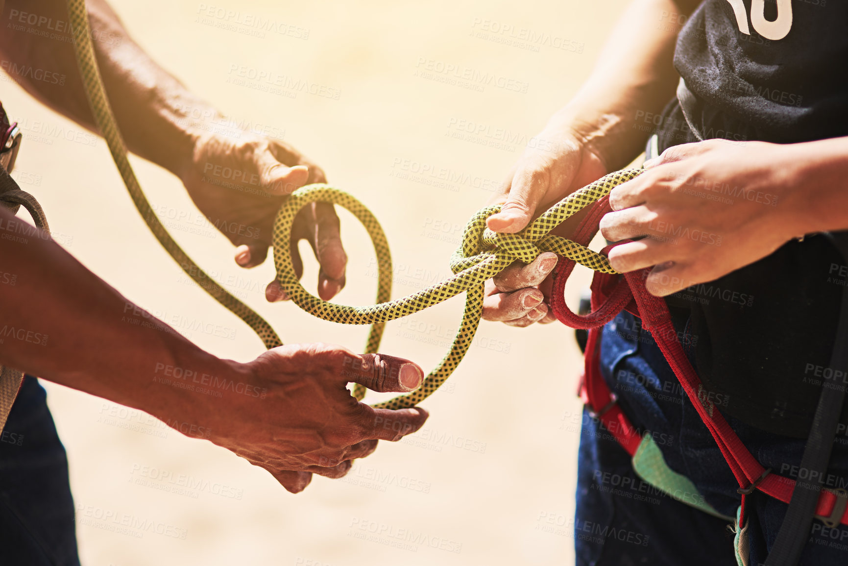 Buy stock photo Rock climbing, adventure and hands of people with rope for training, exercise and outdoor extreme sports. Nature, travel and friends with harness, equipment or gear for fitness, workout and challenge