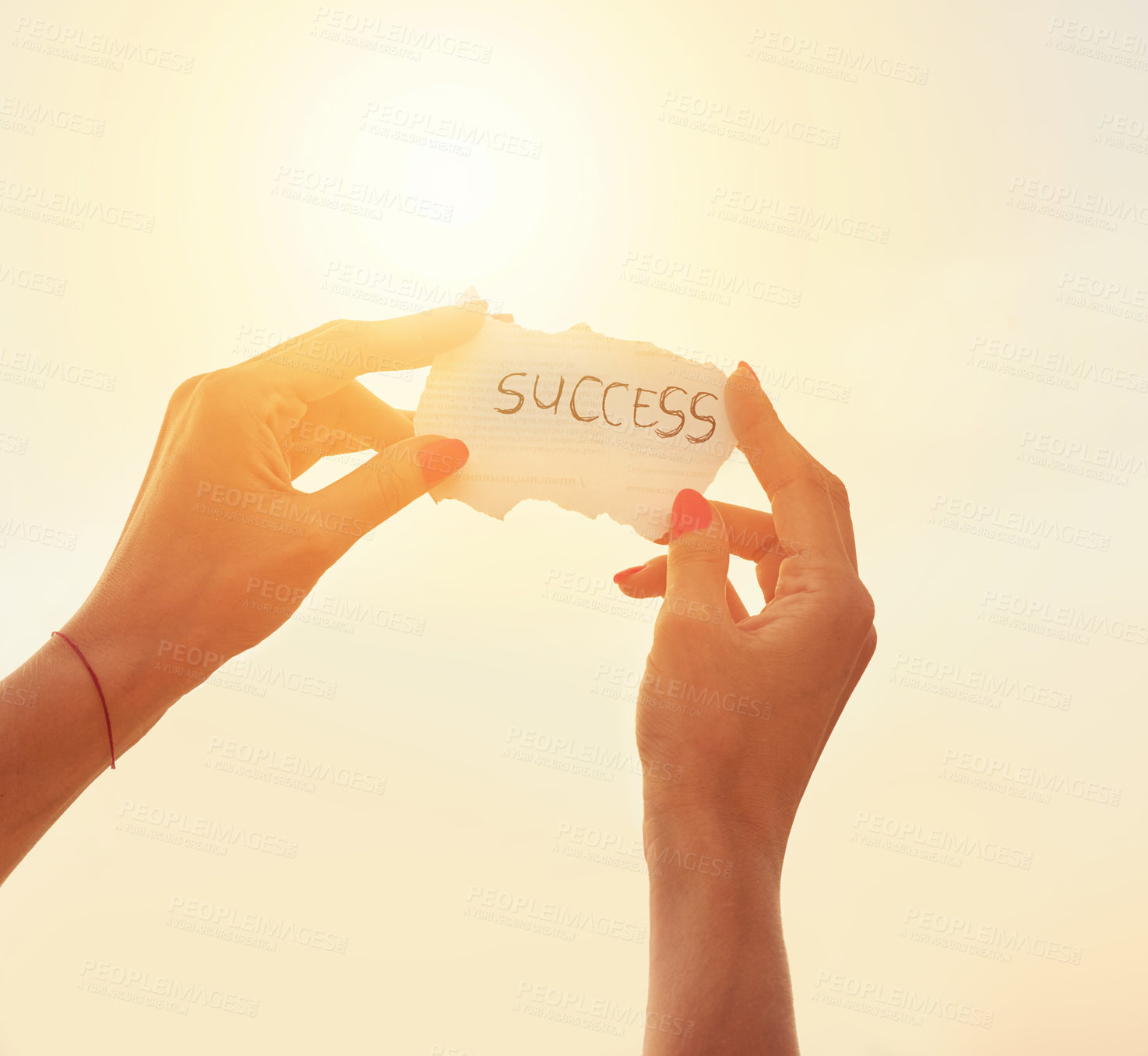 Buy stock photo Cropped shot of an unidentifiable woman holding up a note against the summer sky