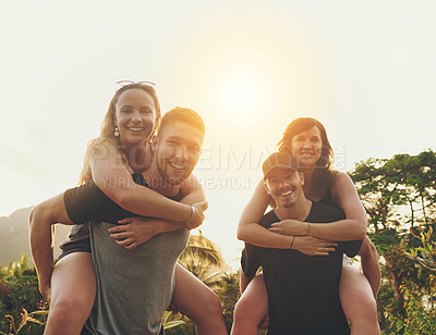 Buy stock photo Shot of a happy group of friends enjoying the day together outside