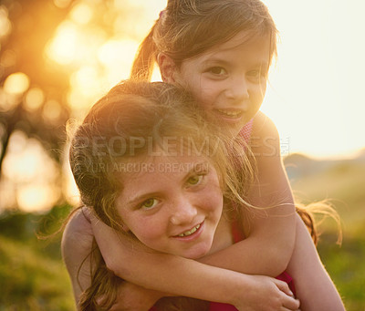 Buy stock photo Portrait of two cute sisters playing together in the park
