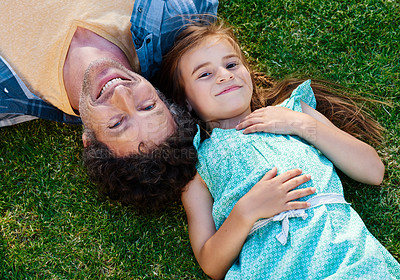 Buy stock photo Dad, girl child and portrait on grass with smile, love and outdoor fun in nature on weekend from above. Bonding, father and daughter in backyard together with support, trust or happy face on lawn