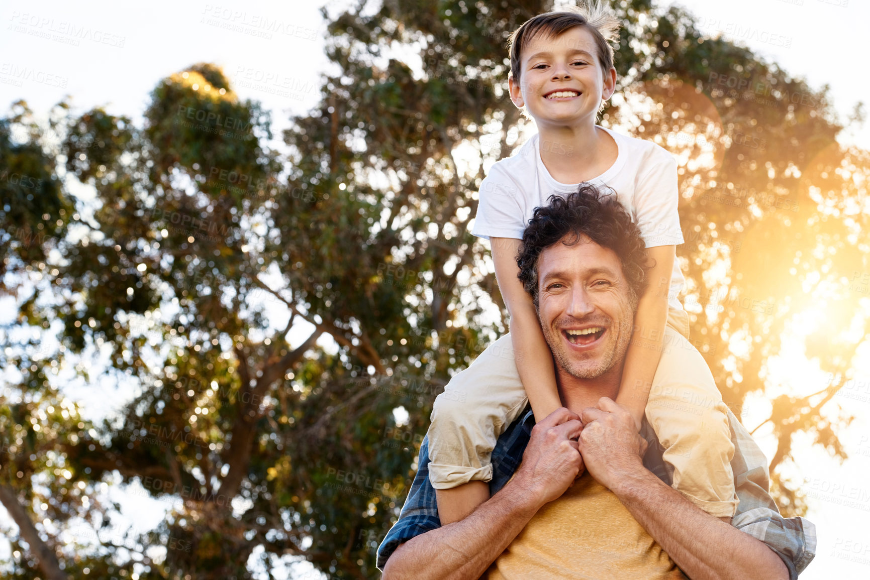 Buy stock photo Park, portrait or father and son with piggyback fun in nature for bonding games on family adventure in forest. Smile, support or happy boy child with proud dad in woods for wellness, courage or love