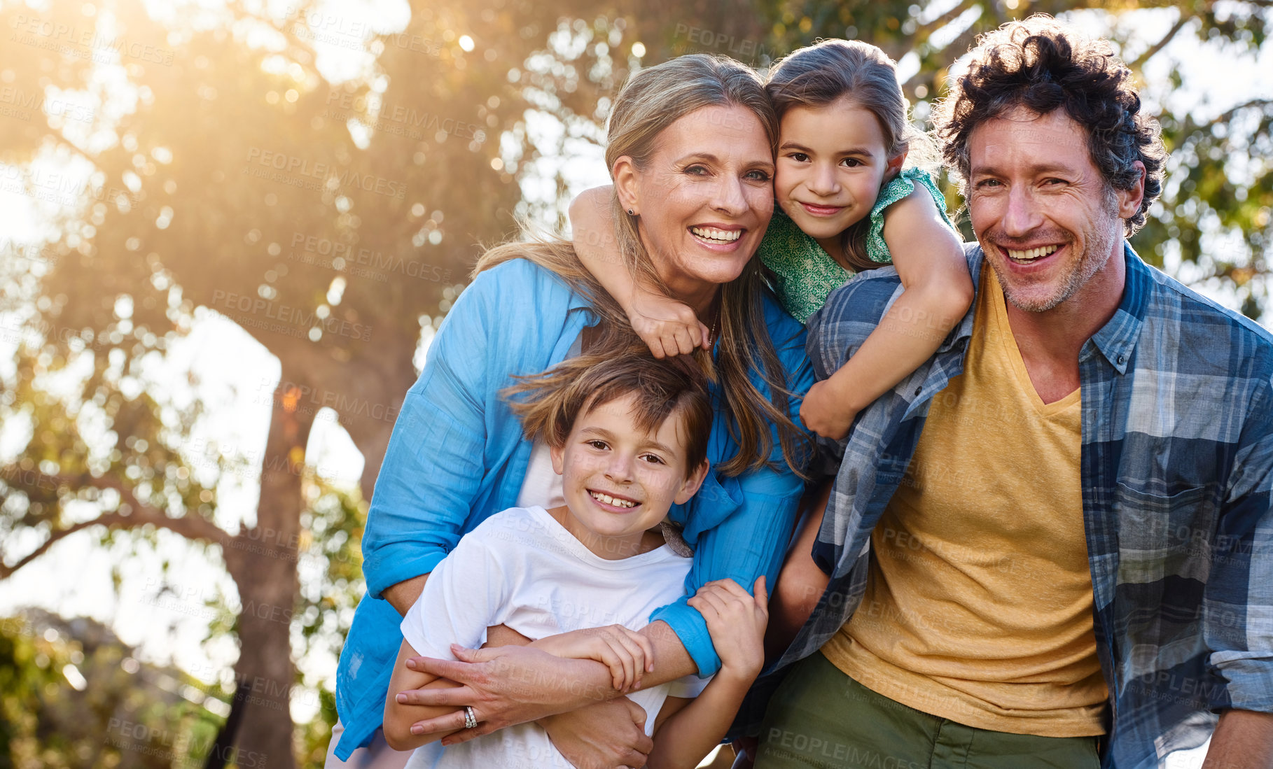 Buy stock photo Portrait, family and hug in embrace for support, development and growth in outdoor or backyard. Woman, man and kids with comfort, child care and parenthood in bonding, relationship and connection