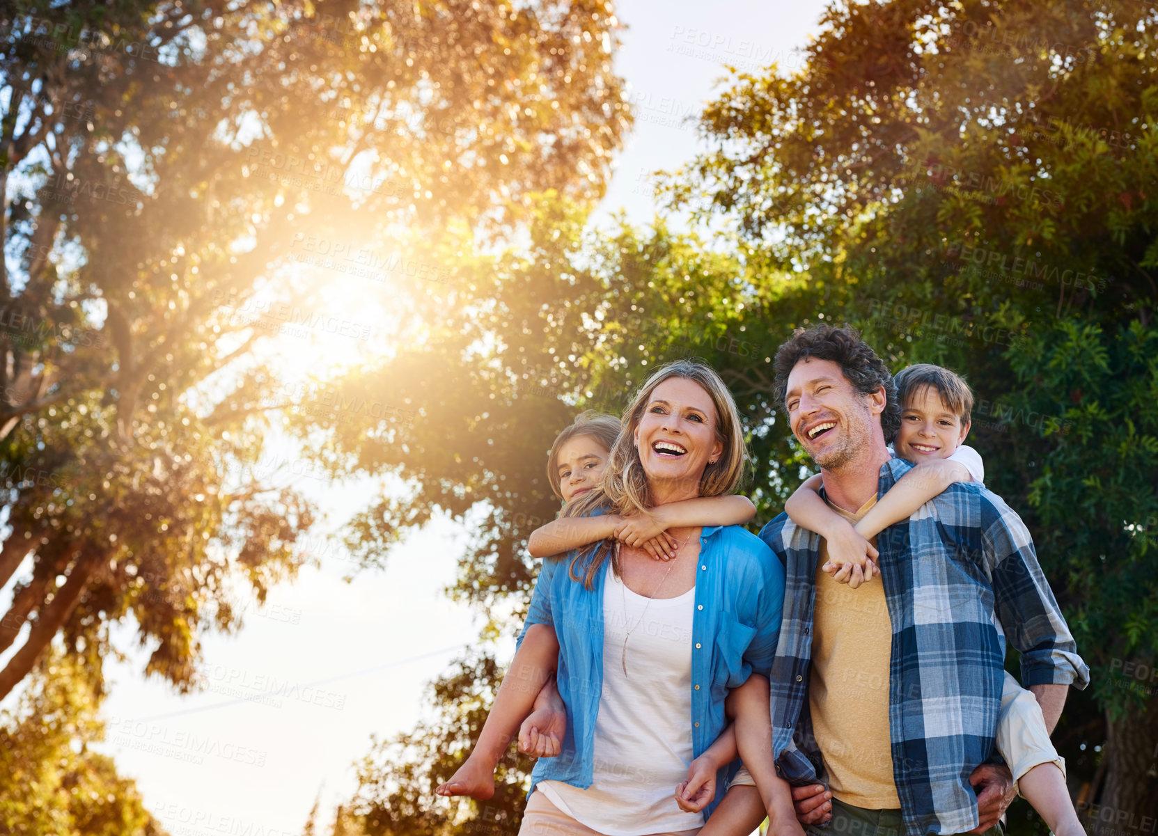 Buy stock photo Family, laughing and piggyback in park with love for bonding, weekend fun and funny games in nature with sunshine. Parents, kids and carry on back for summer activity, outdoor scenery or morning walk