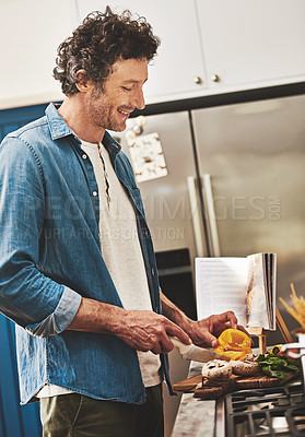 Buy stock photo Smile, food and man cutting vegetables in the kitchen for diet, healthy or nutrition dinner. Happy, cooking and mature male person from Canada chop ingredients for a supper or lunch meal at home.