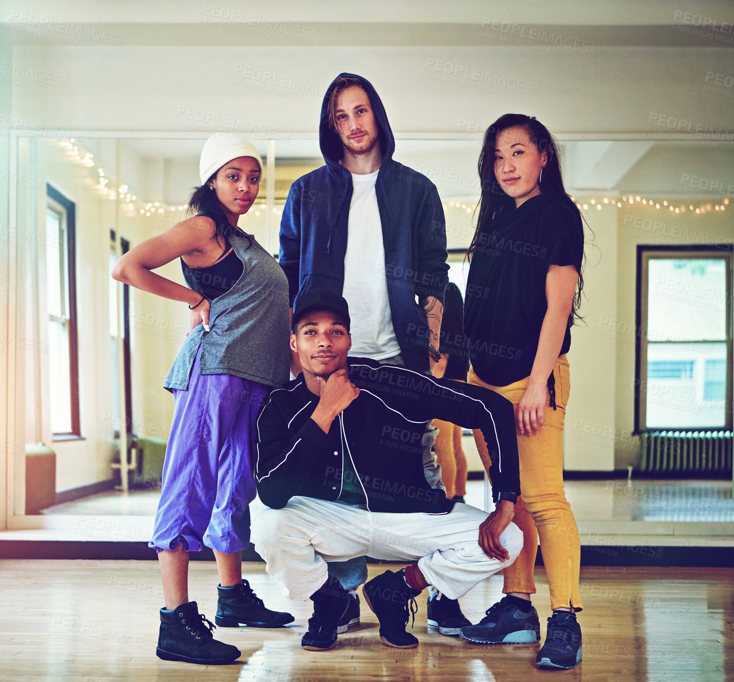 Buy stock photo Shot of a group of young friends hanging out in a dance studio