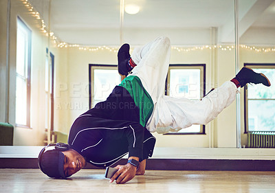 Headphones, music and hip hop dancer for practice, performance with talent, skill and movement for dance battle. Man, jump and Spotify with creative moves, jump and balance, energy and competition