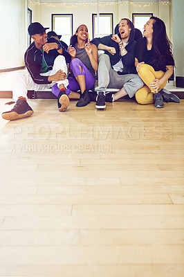 Buy stock photo Shot of a group of young friends hanging out in a dance studio