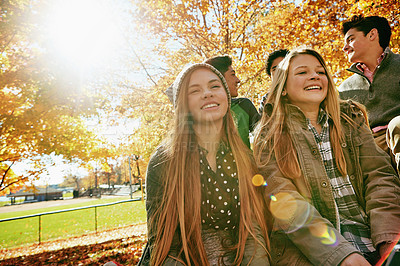 Buy stock photo Smile, teenagers and friends outdoor in park for relaxing day on summer vacation of semester break, together and talking. Group, diversity and trees in garden on holiday in New Zealand and lens flare