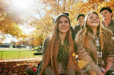 Buy stock photo Laughing, talking and friends outdoor in park for relaxing day on summer vacation of semester break, together and bonding. Group, people and trees in garden on holiday in New Zealand and lens flare.