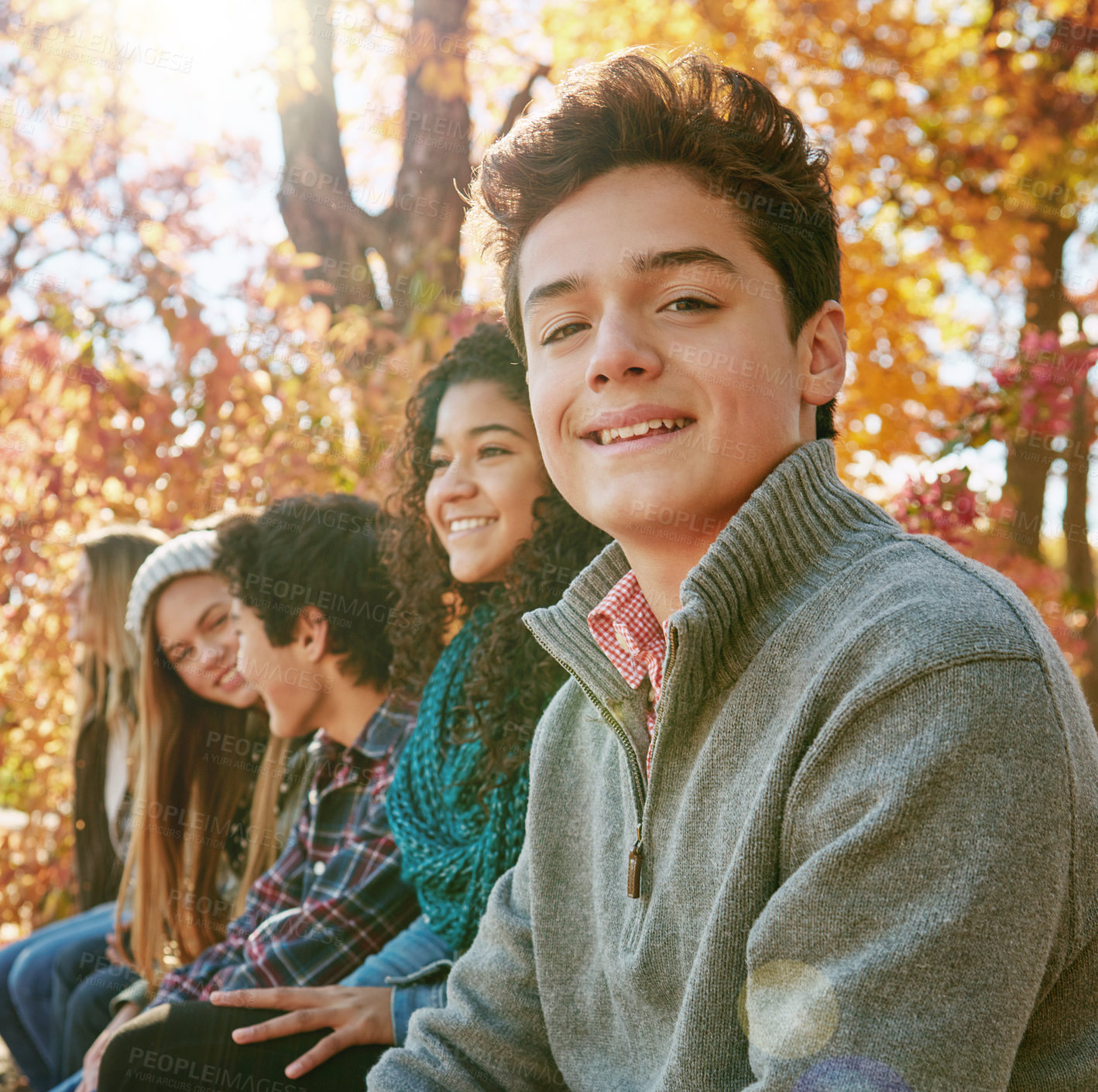 Buy stock photo Boy, group and park with relax or teen with casual, trees in nature with smile. Friends, people and young in portrait or happy with diversity in garden for friendship, youth or wellness in Canada