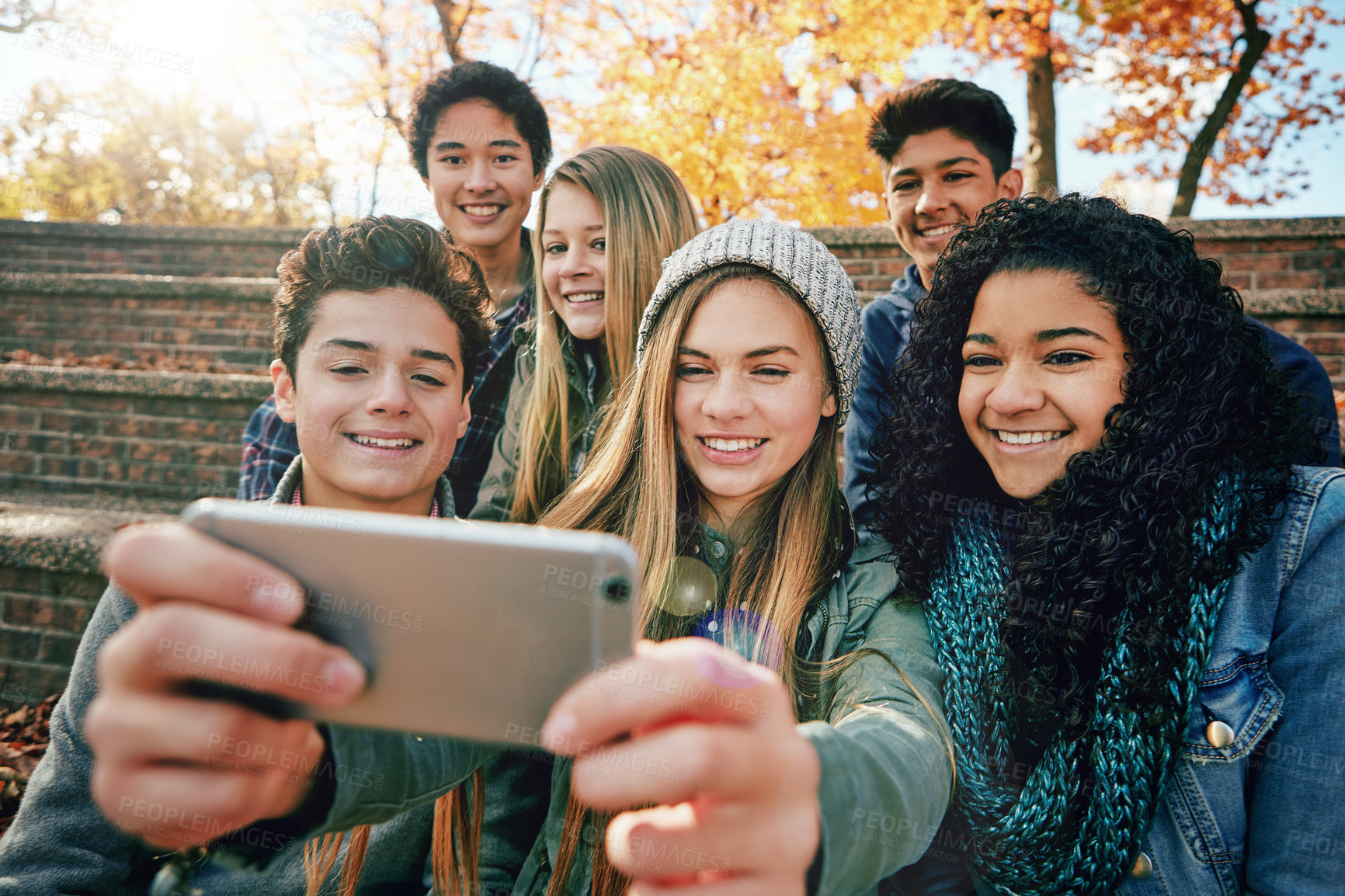 Buy stock photo Selfie, youth or friends in park for social media, online post or profile picture in autumn or nature. Smile, teenage group of boys or happy gen z girls for fun holiday vacation photograph together 