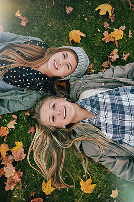 Buy stock photo Top view, friends or girls on grass for lying, relaxing and bonding together in park with happiness. Nature, lawn or teenagers on summer holiday for chilling, hanging out or laugh outdoors with smile