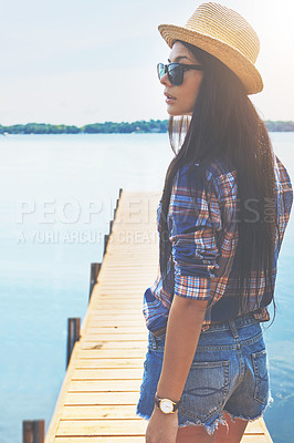 Buy stock photo Shot of an attractive young woman enjoying a day on the beach