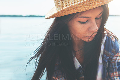 Buy stock photo Shot of an attractive young woman enjoying a day on the beach