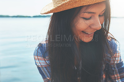 Buy stock photo Shot of an attractive young woman enjoying a day on the beach