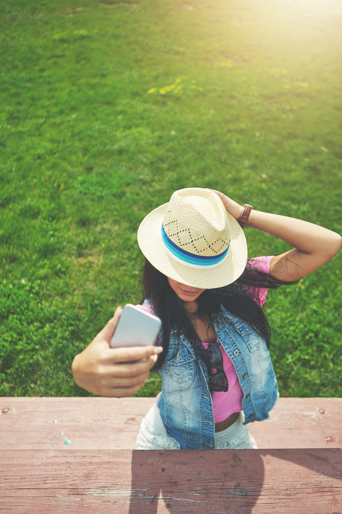 Buy stock photo Shot of a young woman spending a day in the park