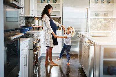 Buy stock photo Happy family, pregnant woman with boy child and in kitchen at their home with lens flare. Mother with love or care, mother and cheerful parent with son bonding with dance in their house together