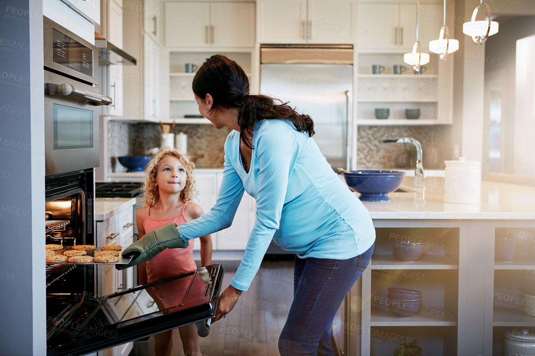 Buy stock photo Mother, daughter and cookies in oven for cooking in kitchen with learning, bonding and fun in home with sunlight. Family, woman and girl with baking dessert, cake and sweet snack by stove in house