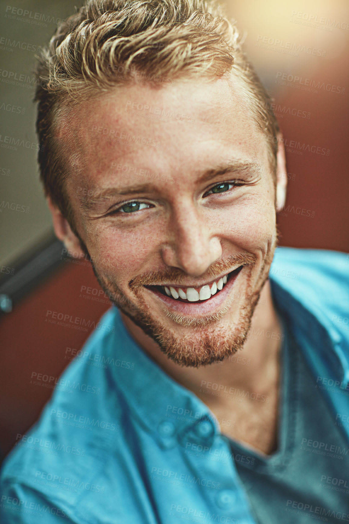 Buy stock photo Portrait of a smiling young man posing alone outside