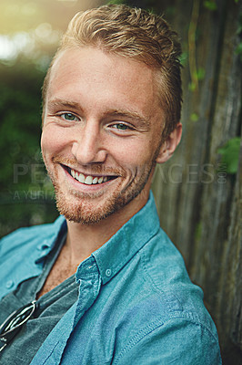 Buy stock photo Cropped portrait of a handsome young man outdoors