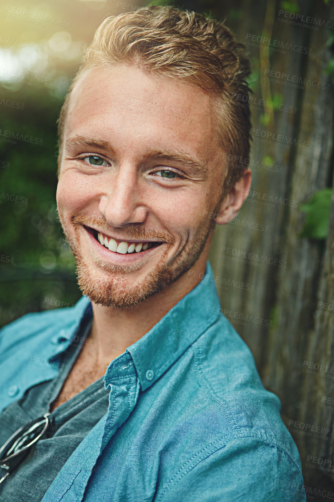 Buy stock photo Cropped portrait of a handsome young man outdoors