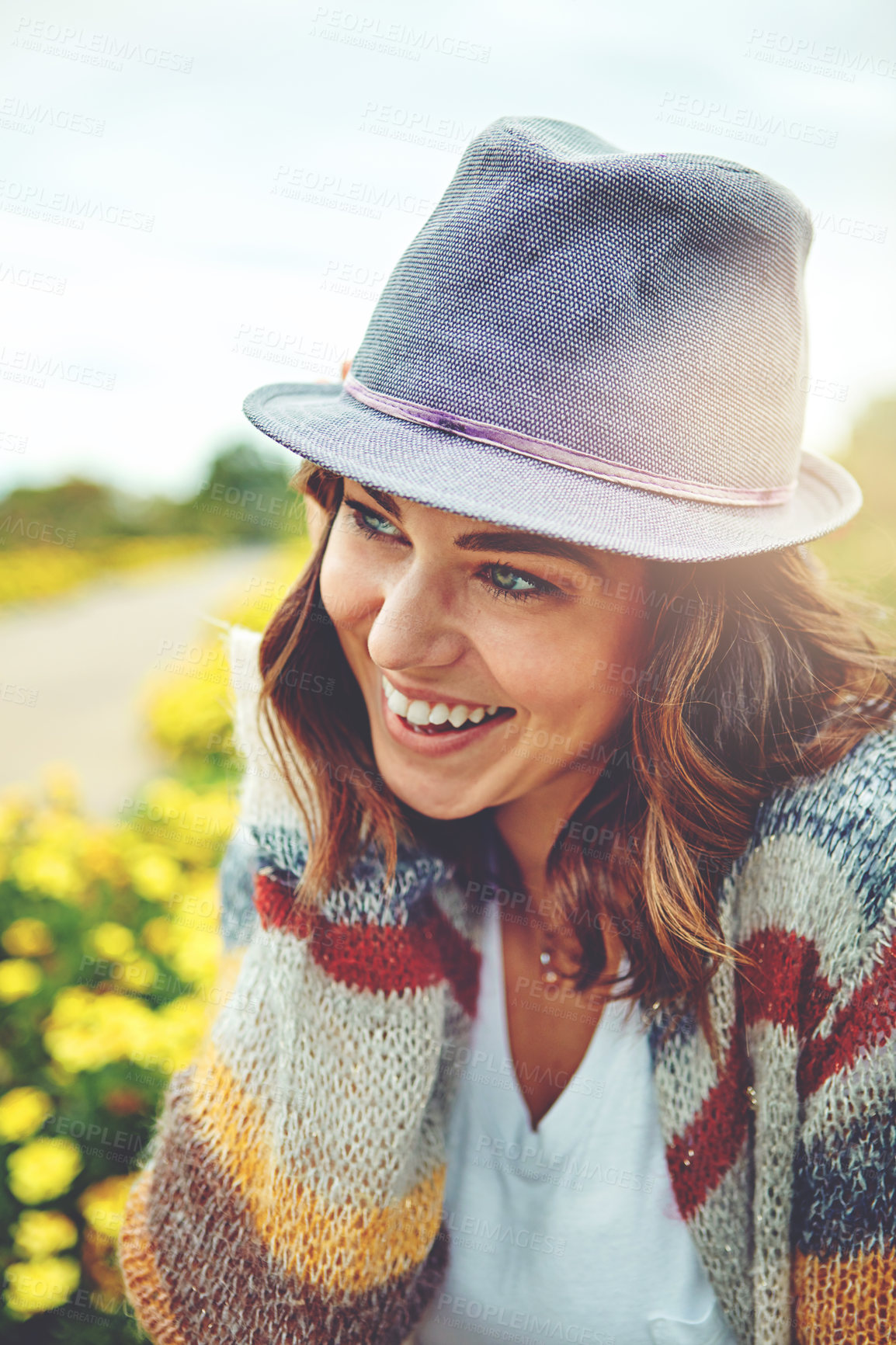 Buy stock photo Shot of an attractive young woman enjoying a spring day outdoors