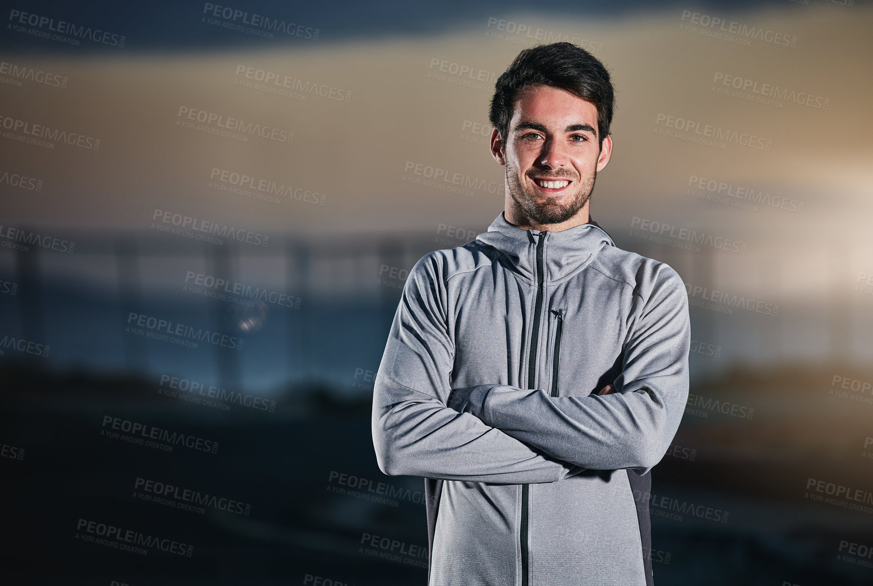 Buy stock photo Shot of a handsome young man exercising outdoors