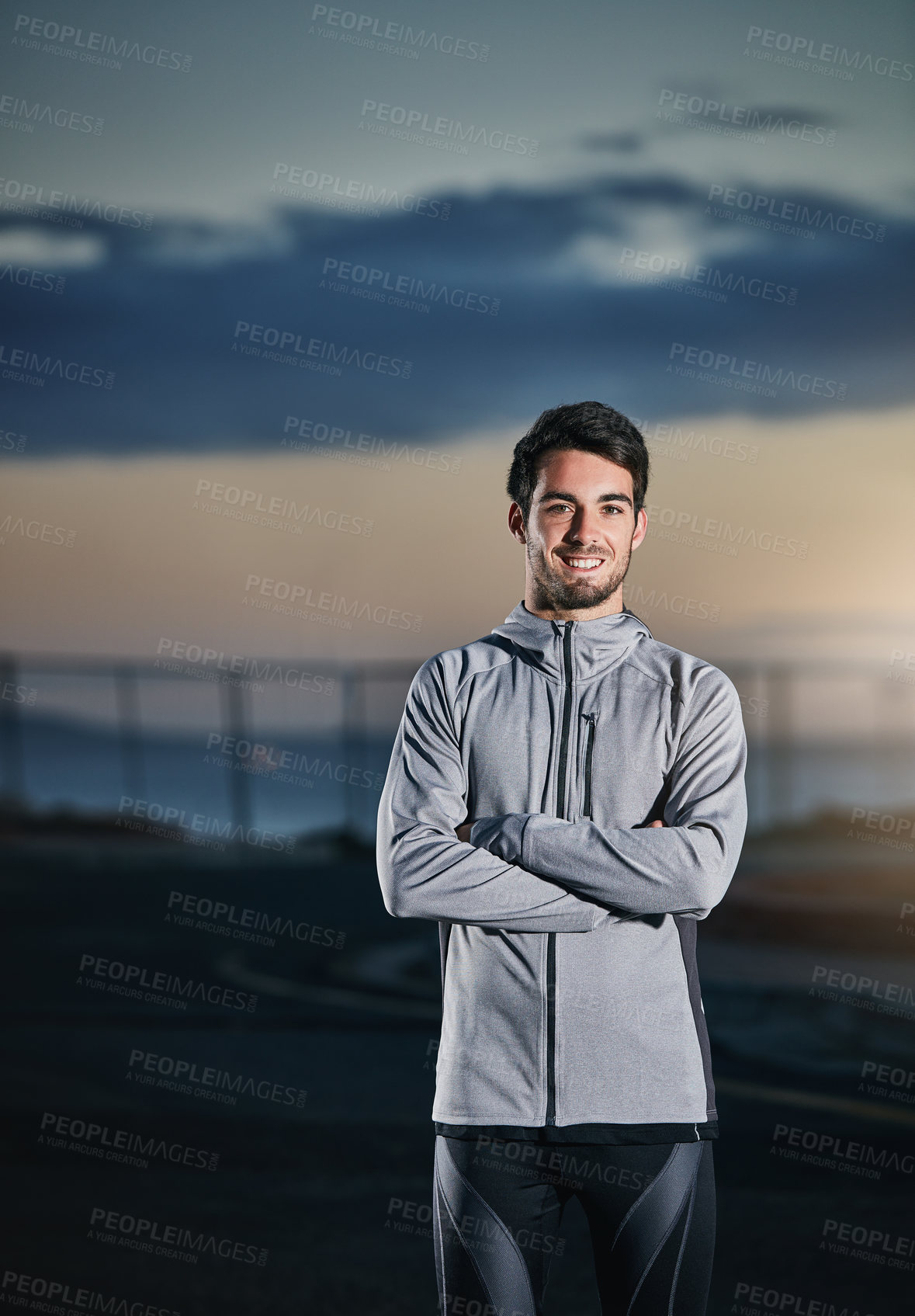 Buy stock photo Shot of a sporty young man out for a run