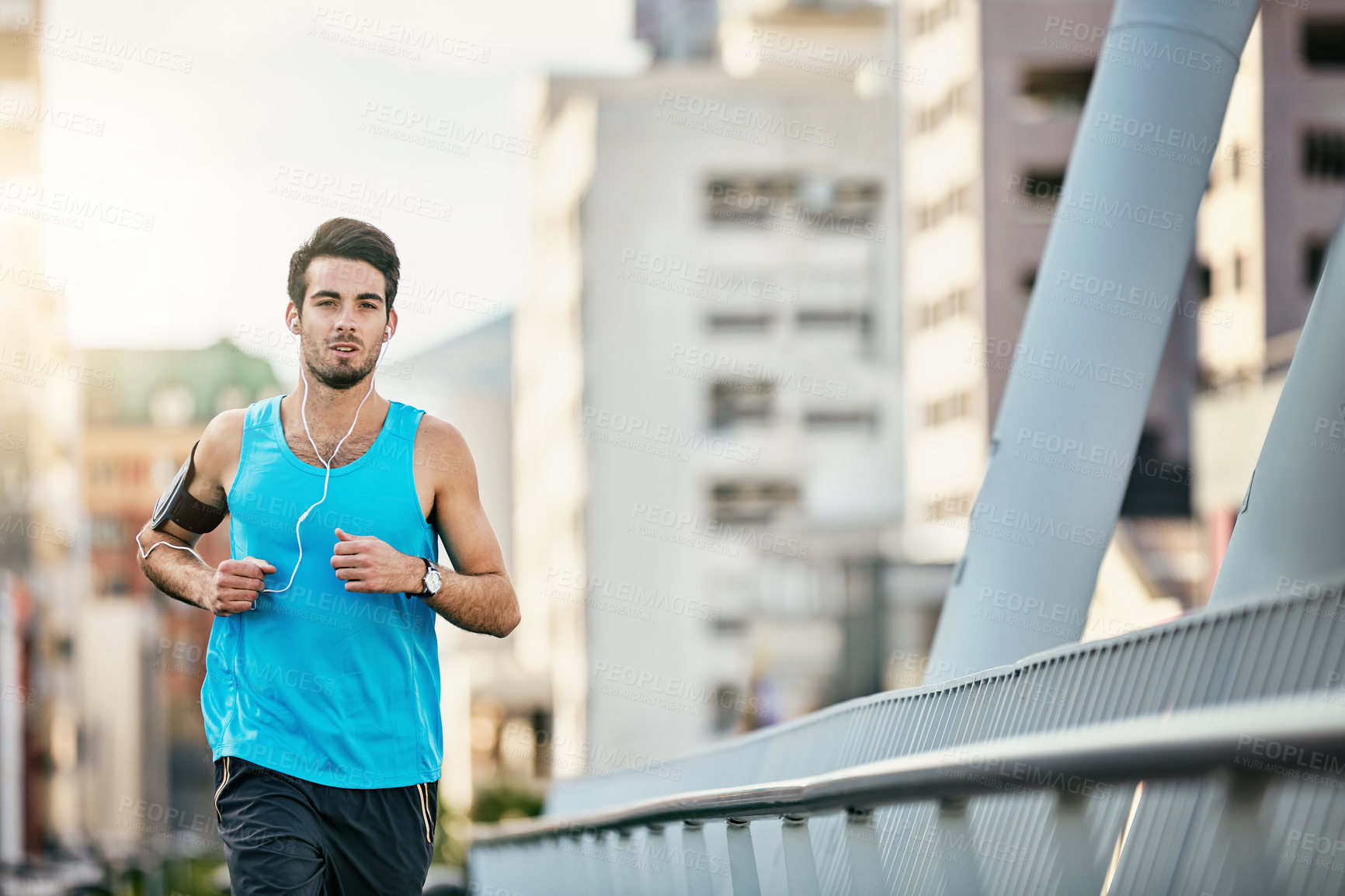 Buy stock photo Cropped shot of a handsome young man working out in the city